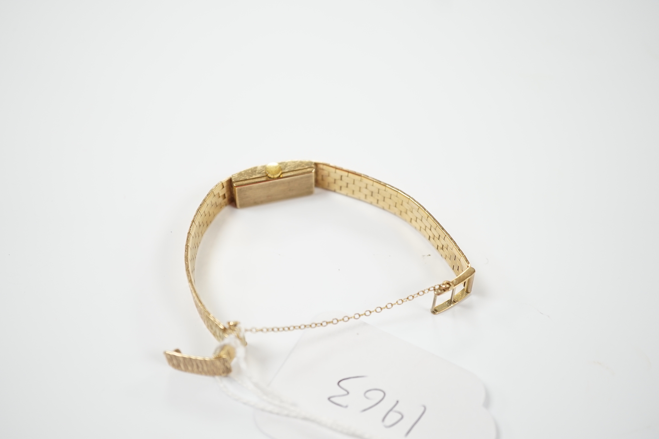 A lady's 1970's 9ct. gold Uno manual wind bracelet wrist watch with a bark textured bracelet, gross weight 24.8 grams.